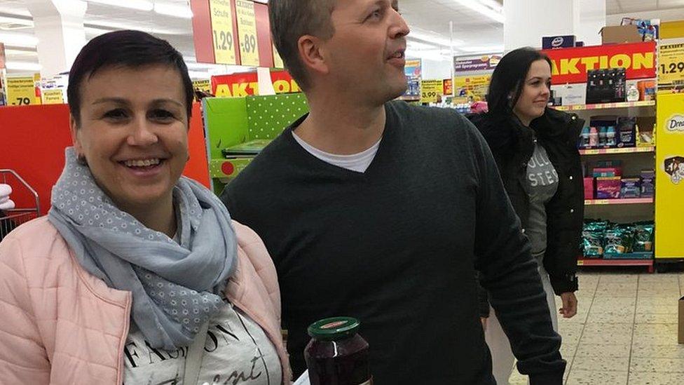 Czech shoppers Petr and Sarka in a supermarket in Altenberg, Germany