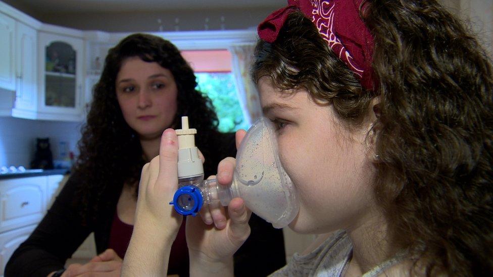 Zona Armstrong uses her nebuliser as her mother Ayrin watches on