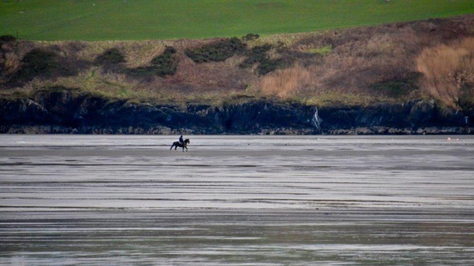 Horse rider on Poppit Sands, Pembrokeshire.