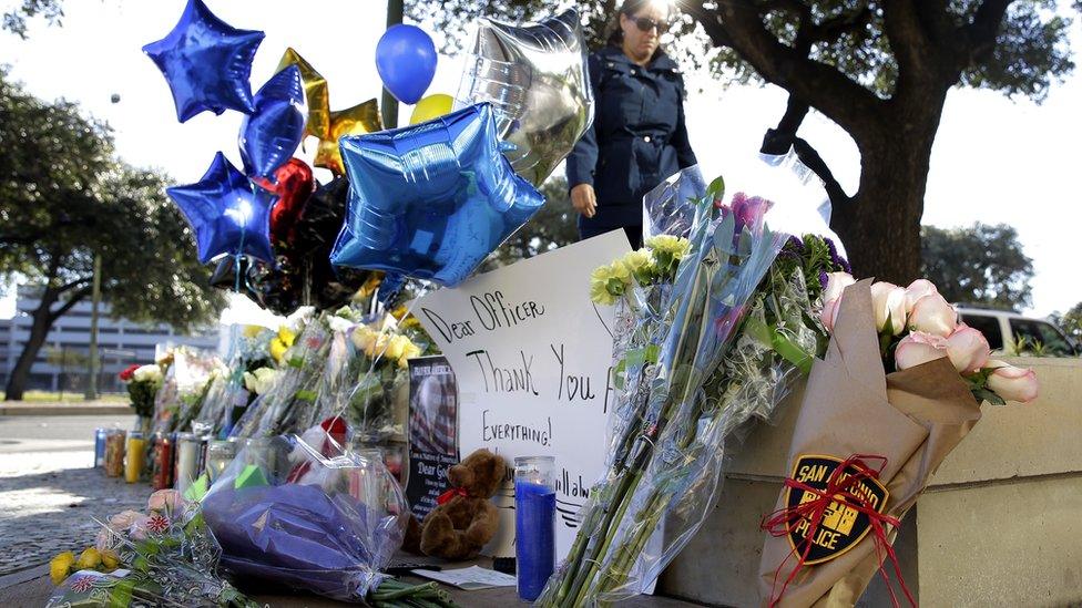 A makeshift memorial for Detective Marconi grew outside of the police station