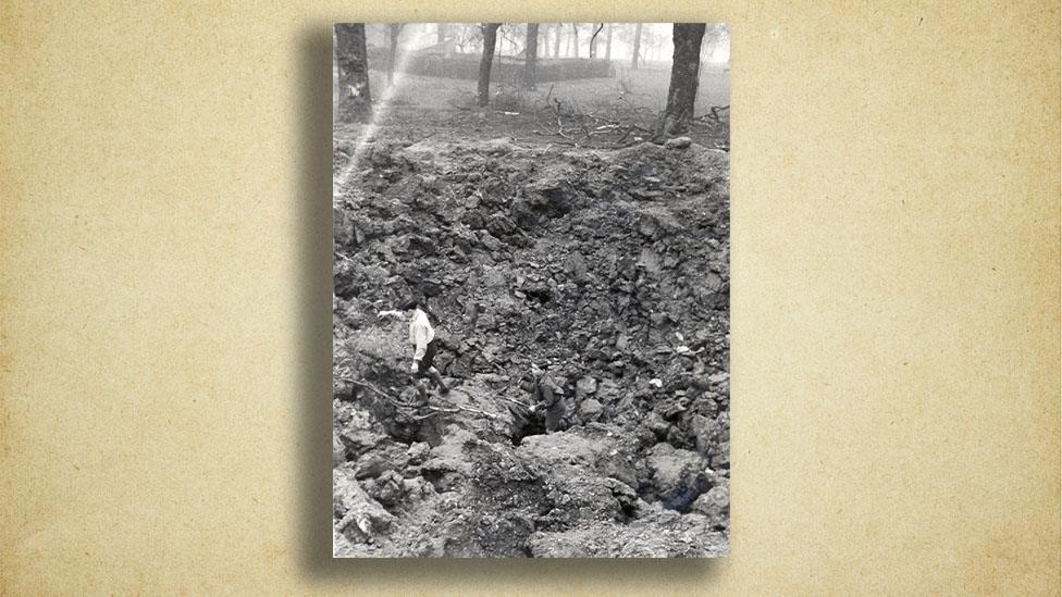 bomb crater with children playing