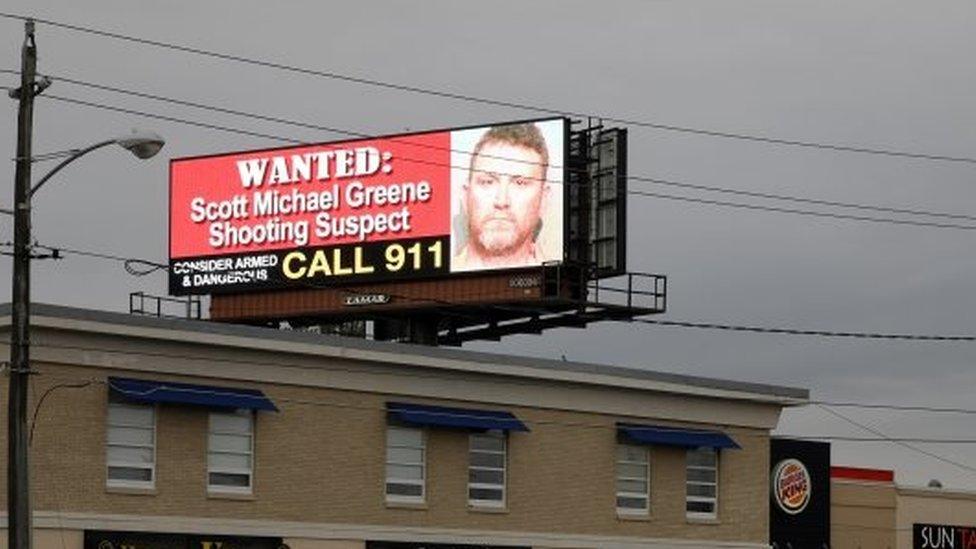 An electronic billboard displays information on a suspect in the killing two police officers in separate shooting attacks in Urbandale and Des Moines, Iowa, U.S., November 2