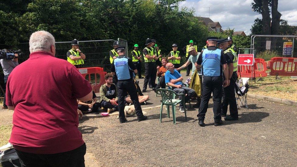 Protesters near the oak tree