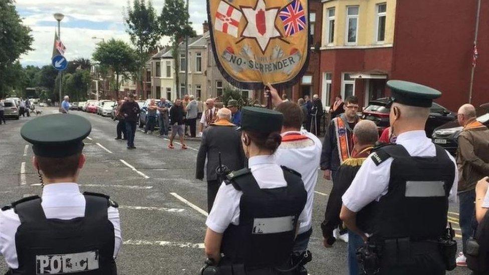 Members of the three lodges involved in the Ardoyne parade dispute arrived at police lines led by the Ballysillan banner in 2016