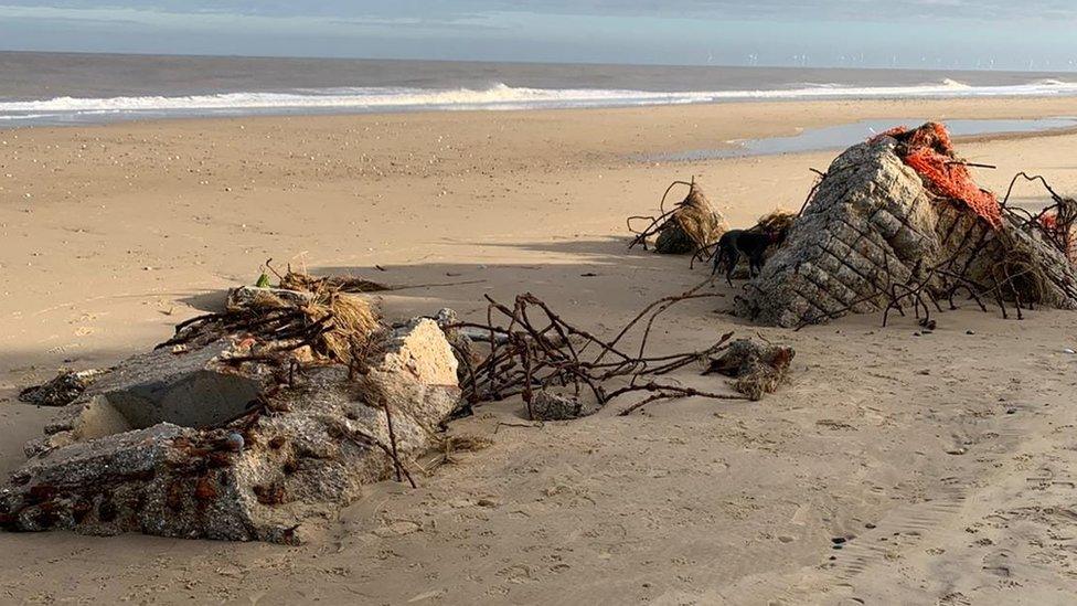 Remains of a former cafe on a beach