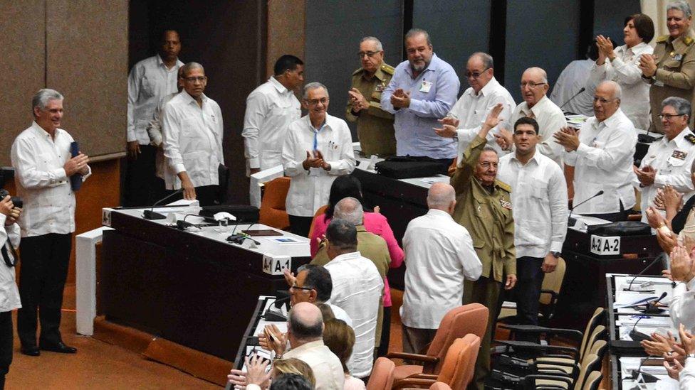 Cuban President Miguel Diaz Canel applauds former President Raul Castro at the Cuban Parliament at the Convention Palace in Havana, on 2 June 2018