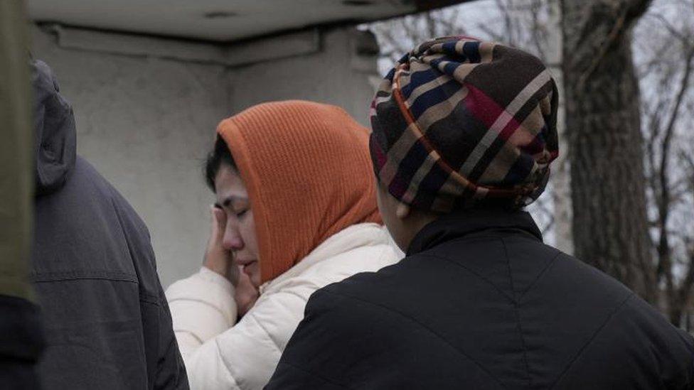 A woman cries at the entrance to the Kostenko coal mine operated by ArcelorMittal Temirtau, as a rescue operation continues following a mine fire, in Karaganda, Kazakhstan