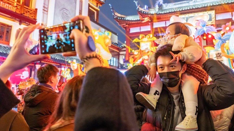 A family enjoyed the illuminated lanterns to celebrate the Lantern Festival on February 5, 2023 in Shanghai, China.