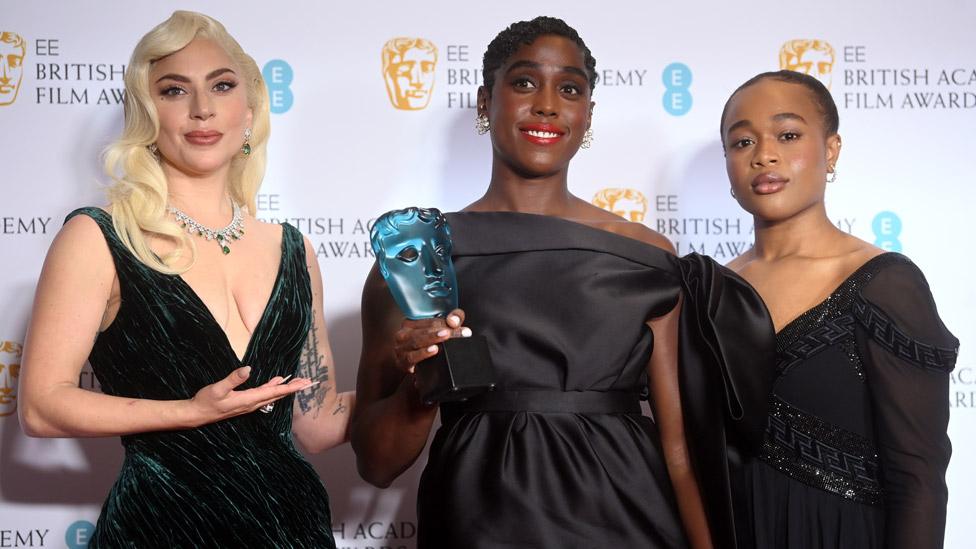 Lashana Lynch (centre) with Lady Gaga (left) and last year's Rising Star winner Bukky Bakray