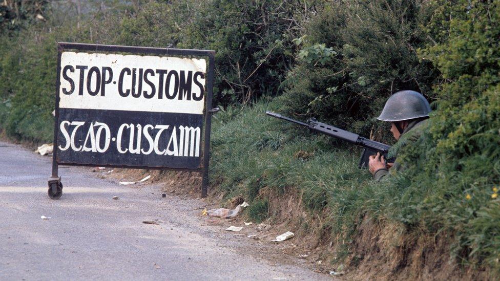 An Irish soldier guards a customs post on the southern side of the border at Swanlinbar, County Cavan, in the mid 1970s