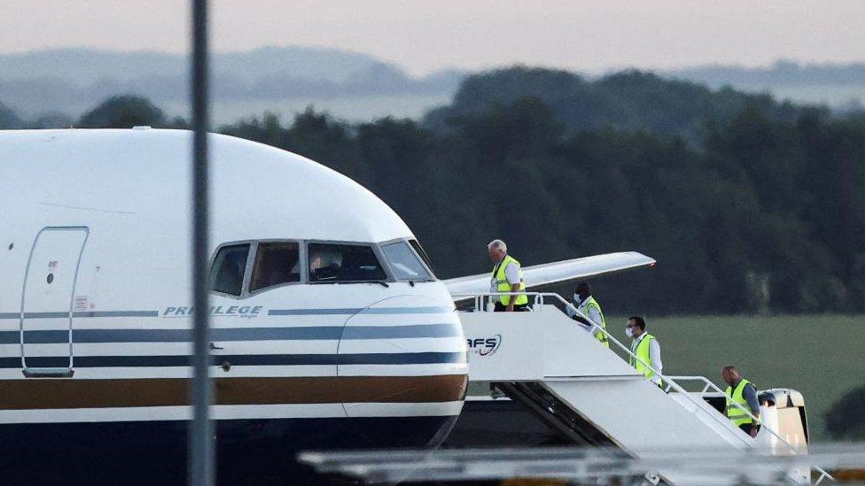 People boarding a plane