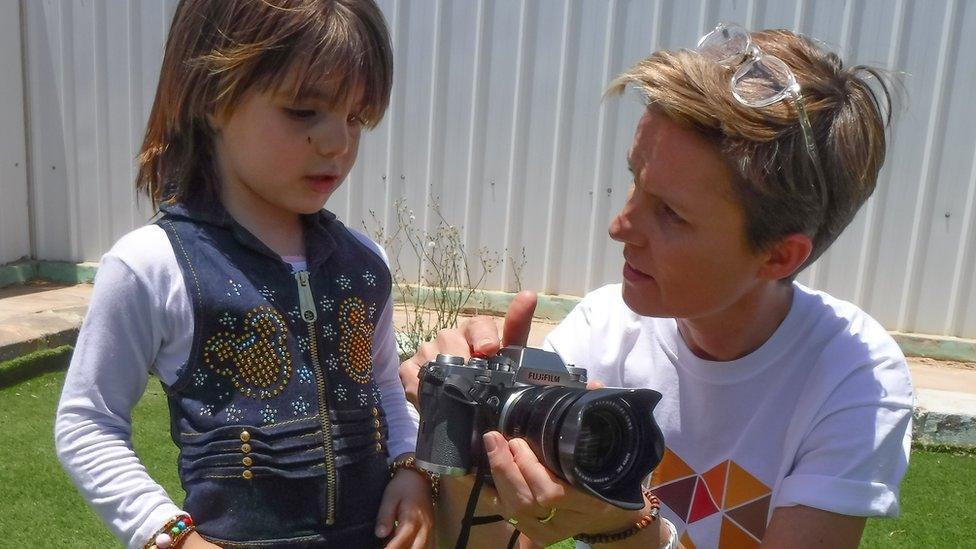 Kate Green and young refugee