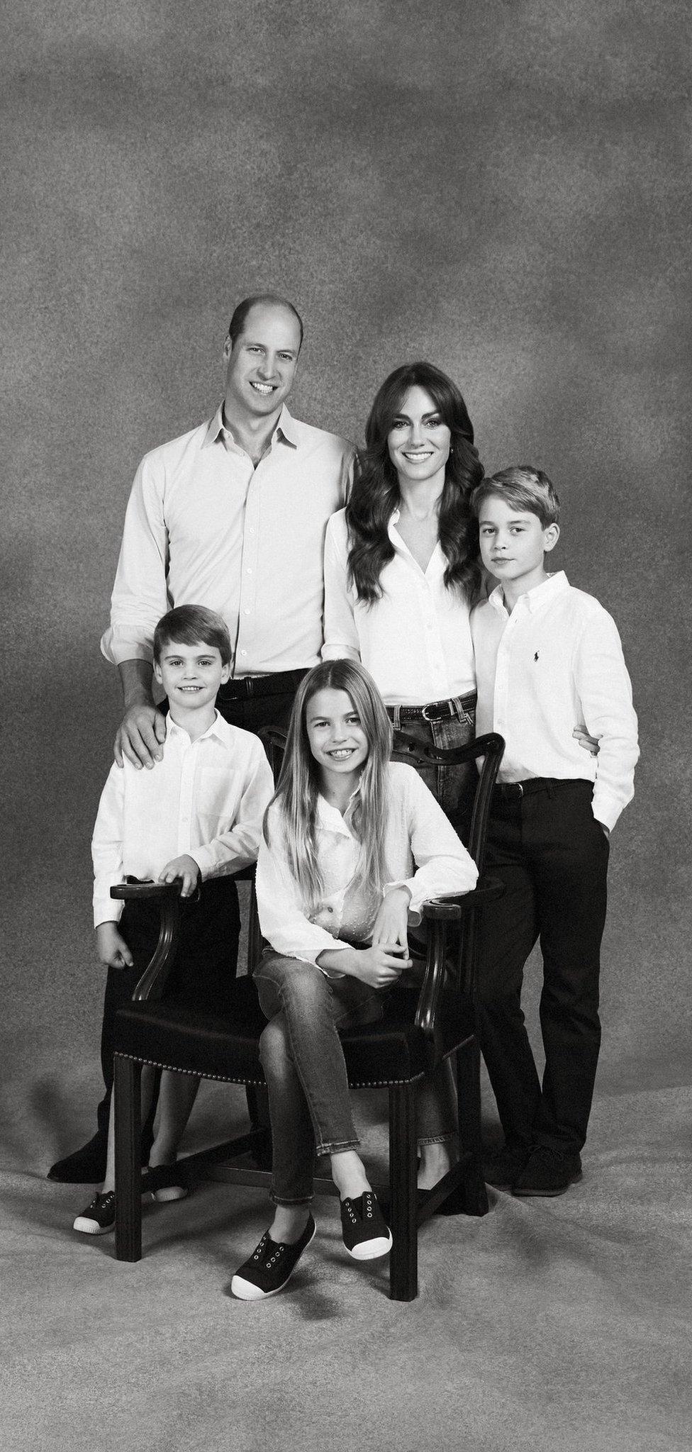 The Prince and Princess of Wales pose for their annual Christmas card picture, alongside their three children, George (R), Charlotte and Louis (L)