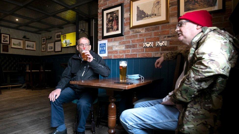 Two of the first customers to be served at The Scotsman's Lounge pub in Edinburgh