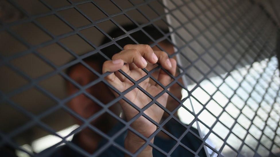 An El Salvadorian child is transported for processing after he and his family crossed from Mexico into the United States to seek asylum in Roma, Texas, 14 April 2016