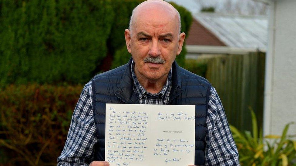 Shopkeeper Jim Barr holds an anonymous letter of apology from someone who says they stole from his shop thirty years ago