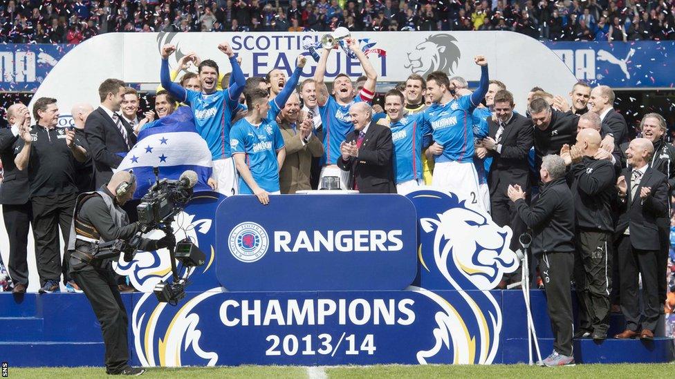 Skipper Lee McCulloch lifts the League One trophy as Rangers go through the entire campaign without losing a match.