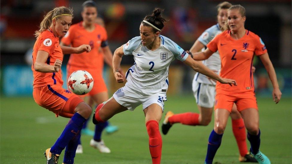 Netherland"s Anouk Dekker (left) and England"s Lucy Bronze (centre) battle for the ball