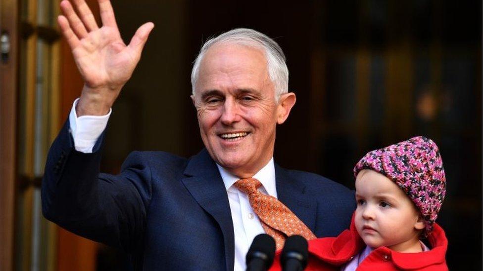 Malcolm Turnbull holds and granddaughter Alice in his final press conference as prime minister on Friday