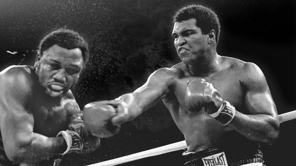 Muhammad Ali hitting Joe Frazier in 1975