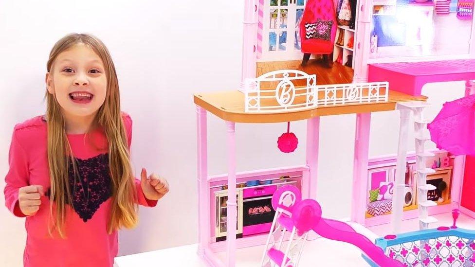 Ava and the Barbie house