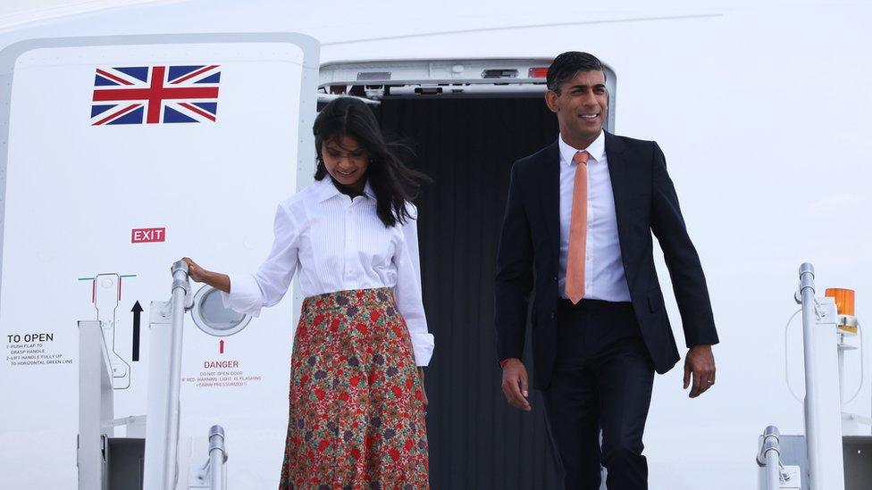 Rishi Sunak and his wife exit his plane