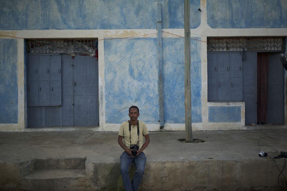 Man in front of a house