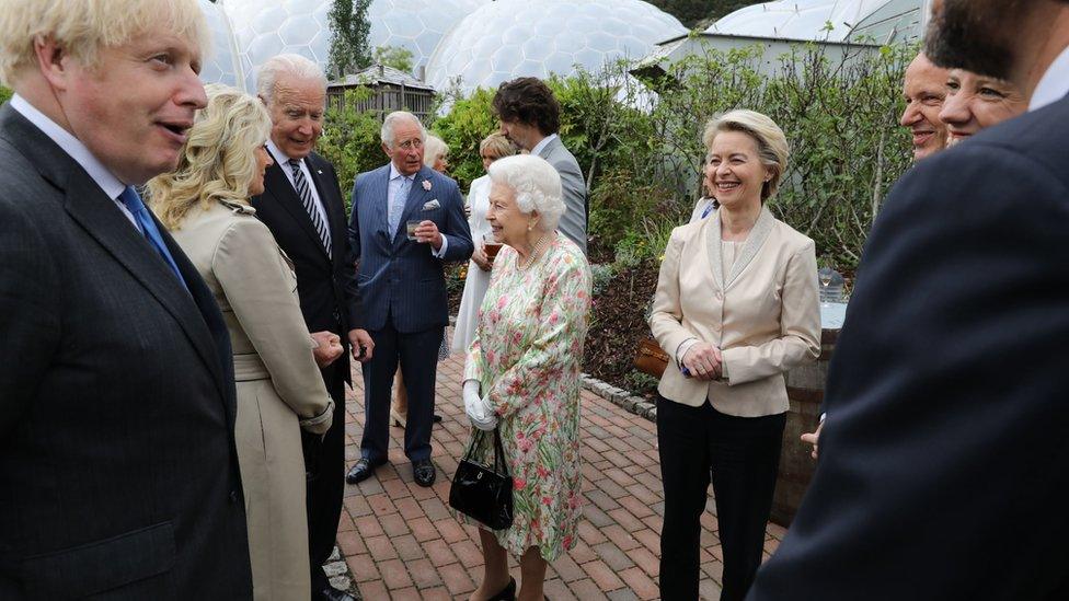 queen mingles with guests