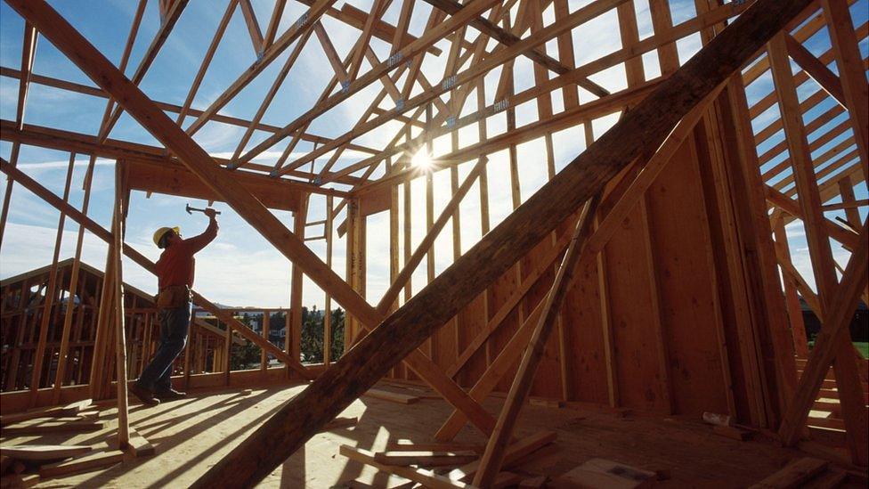 Carpenter working on a house