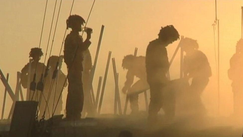 File photo of British soldiers in silhouette