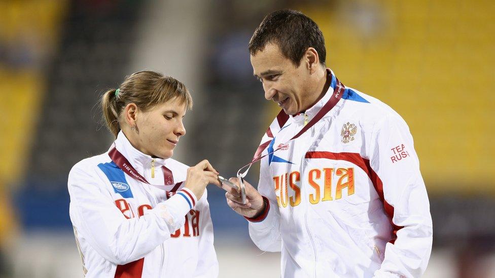 Elena Pautova of Russia examines her silver medal for the women's 1500m T13 final during the Evening Session on Day Nine of the IPC Athletics World Championships