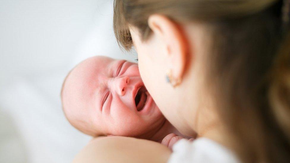 Mother holding baby