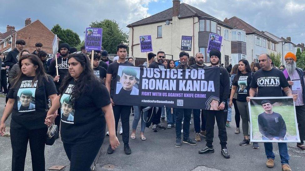 A group protesting for justice for Ronan Kanda