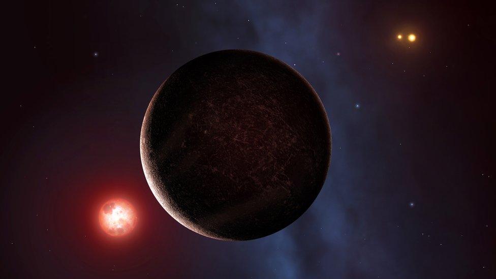 Artist's impression of an exoplanet with two stars in the background