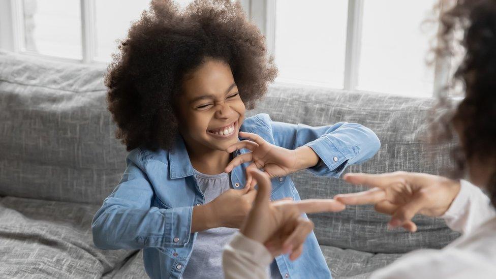 deaf-girl-doing-sign-language