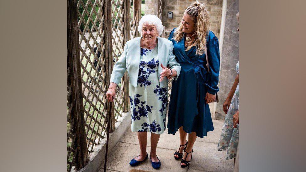 Dotty and Poppy walking into the wedding