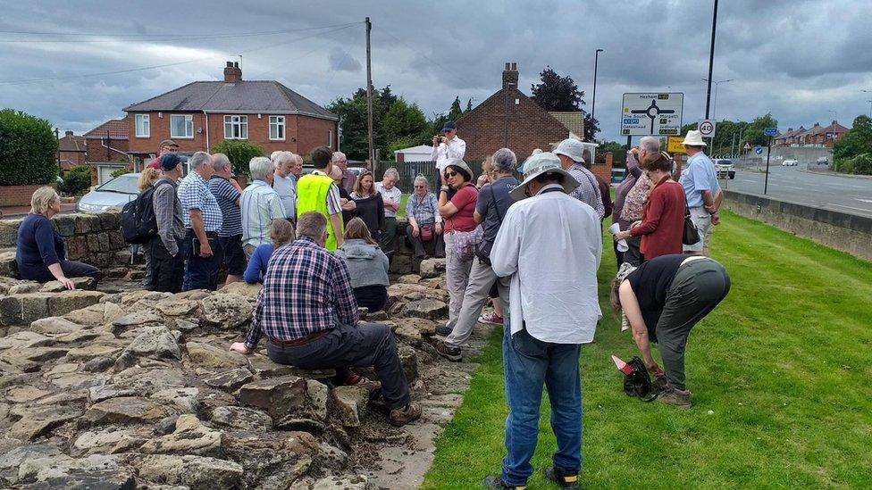 Pilgrims at Turret 7B at Denton, guided by Dr Matt Symonds