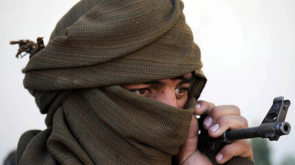 Alleged former Taliban fighters at a disarmament ceremony in Jalalabad, February 2016