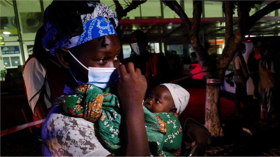 Aida Cisto, a 29 years old woman displaced from Palma, who spent 4 days hidden in the forest with her one month old daughter Jacinta da Esperanca, arrives at Pemba Airport, Mozambique, 30 March 2021.