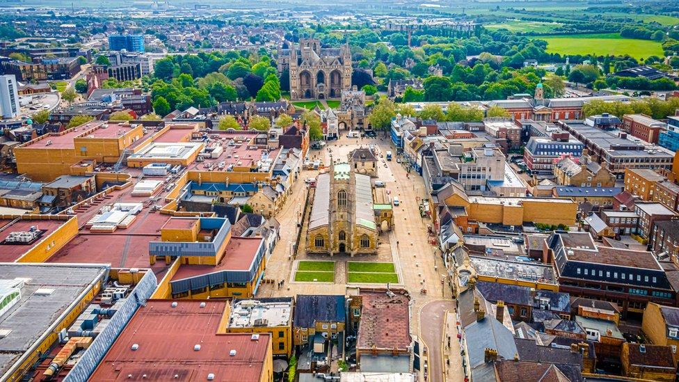 Aerial view over Peterborough city centre, including cathedral and Queensgate shopping centre