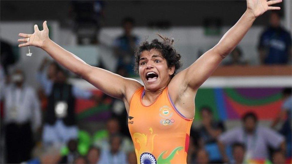 India"s Sakshi Malik celebrates after winning against Kirghyzstan"s Aisuluu Tynybekova in their women"s 58kg freestyle bronze medal match on August 17, 2016,