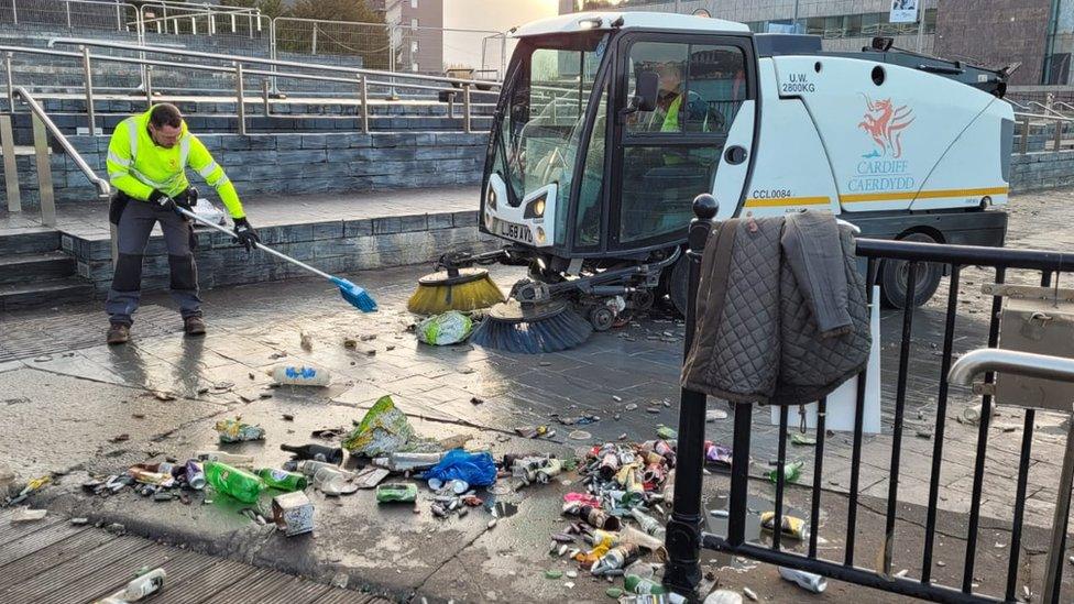 Street cleaning outside the Welsh Parliament on Saturday morning