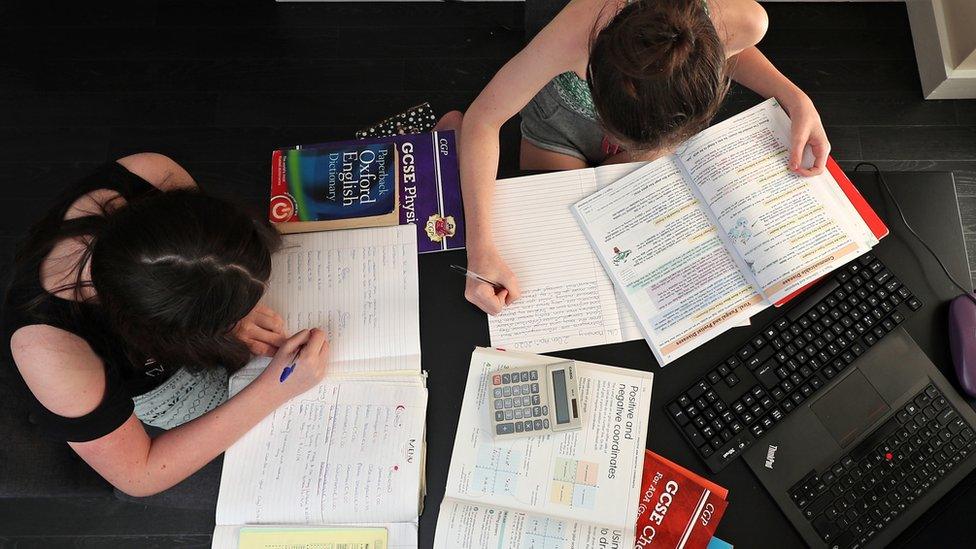 Two young people study at home