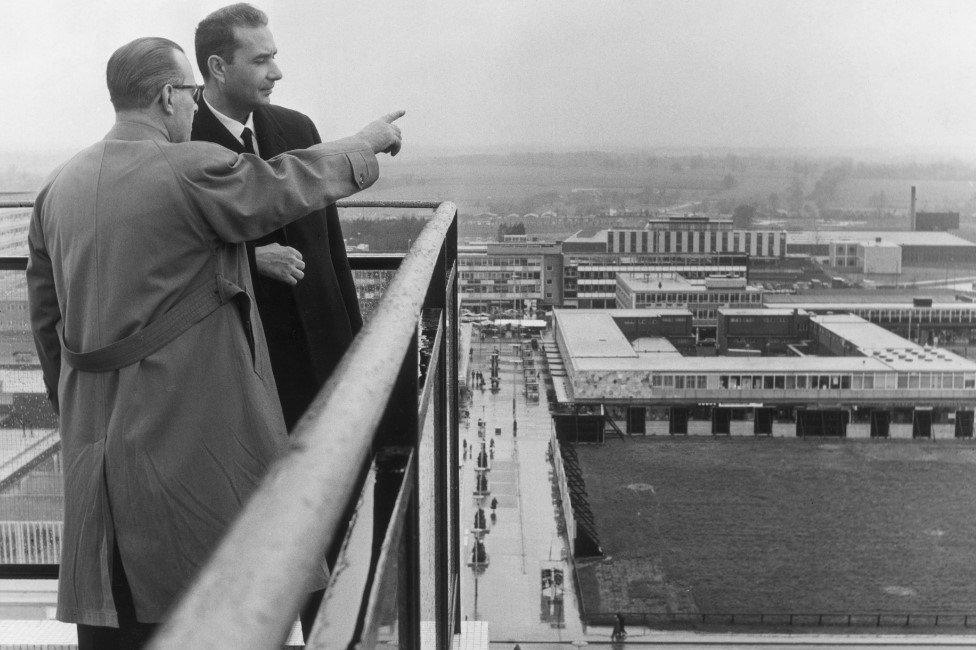 28th April 1964: Councillor Reginald Ward, chairman of the Harlow Urban District Council, points out features of Harlow New Town in Essex to visiting Italian prime minister Aldo Moro (1916 - 1978), from the roof gallery of the Town Hall.