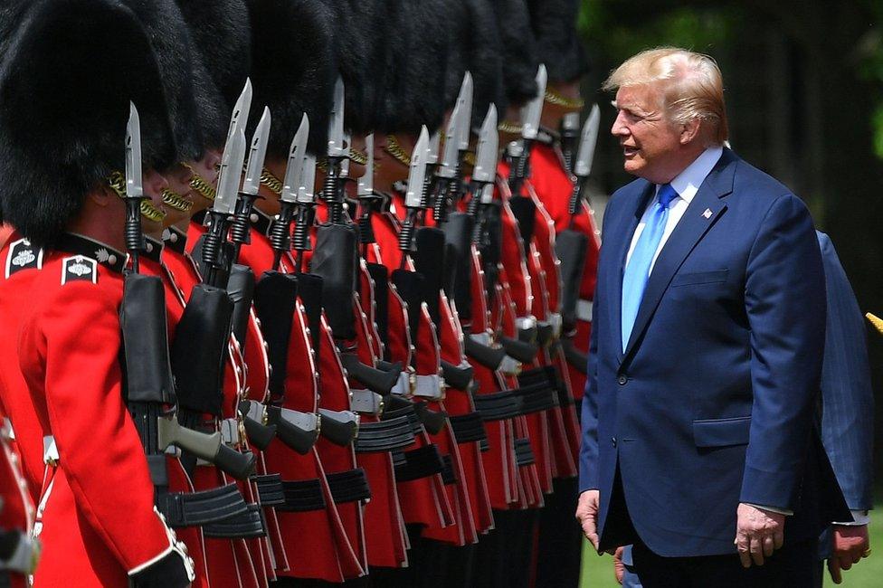 Mr Trump inspects an honour guard during the welcome ceremony