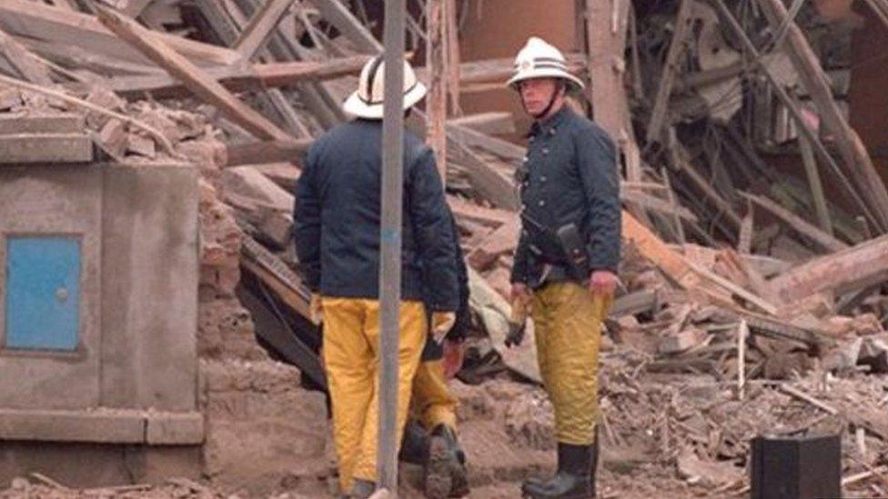 Firemen at the scene of the 1987 Enniskillen bomb attack