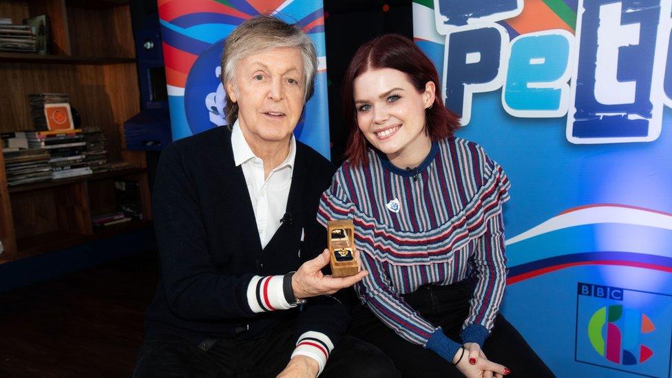 Sir Paul McCartney with Blue Peter presenter Lindsey Russell and his gold badge