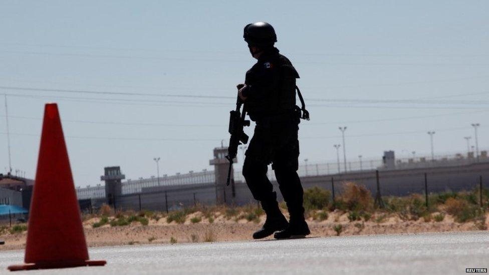 A federal police officer stands guard near the prison in Ciudad Juarez where "El Chapo" Guzman was transferred. (7/05/16)