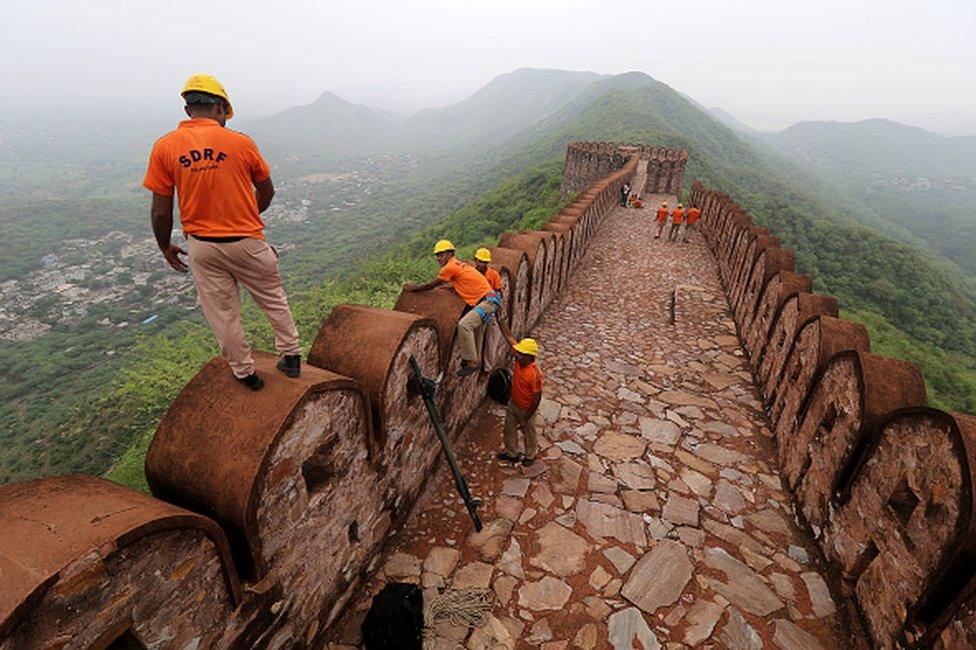 State Disaster Response Force members during search operation work after lightning strike at Watch Tower near historical Amer fort in Jaipur, Rajasthan , India, Monday, July 12, 2021. 11 people died and many were injured in the lightning incident.