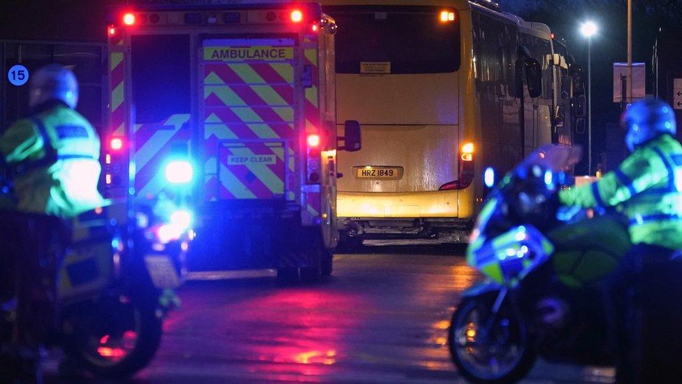 An ambulance and police are seen outside Arrowe Park hospital